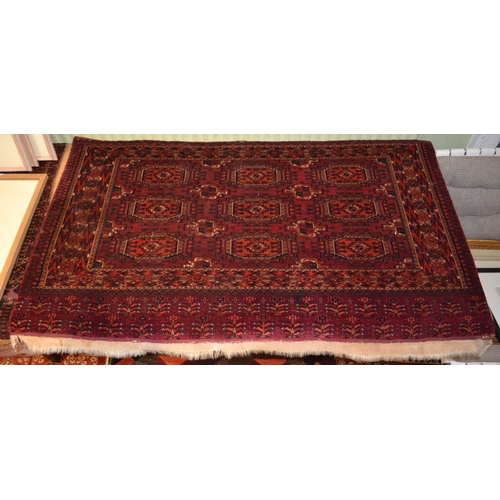 91 - A Tekke Turkoman tent panel, red ground with elephant foot design, fringed on one side, 144cm x 80cm