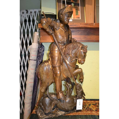 18 - A 16th century wood carving 'St George & the Dragon', poly-chrome painted & partial gilt.  St George... 