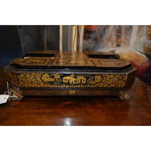 29 - An early 19th century Chinese Canton black lacquer games box with gilded and red border decoration, ... 