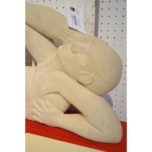 30 - Attributed to Peter Wright (1919-2003) A stone sculpture, reclining male nude, 66cm wide by 43cm hig... 