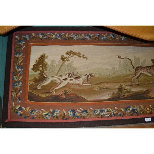 93 - A 17th Century French tapestry panel depicting a pair of hounds to the left chasing a central leopar... 