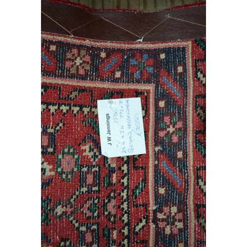 98 - A Persian Hosseinabad runner, red ground, geometric design, fringed and bordered, 772cm x 70cm