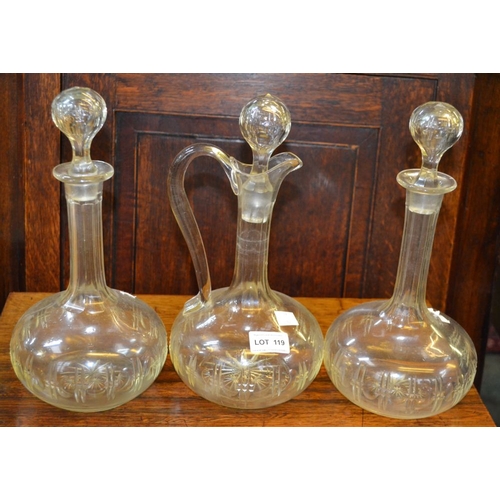 119 - A pair of vintage decanters and stoppers together with the matching claret jug (3)