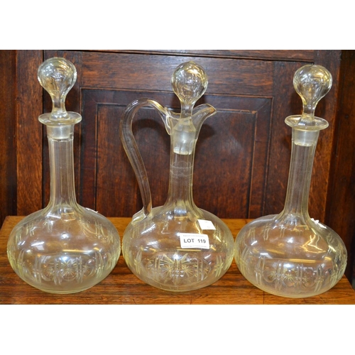 119 - A pair of vintage decanters and stoppers together with the matching claret jug (3)