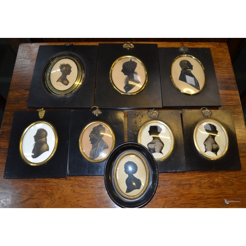 136 - A selection of 19th century black framed silhouettes, mostly painted