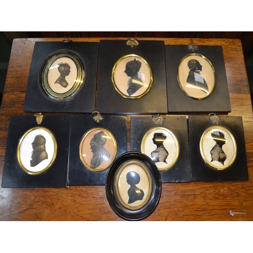 136 - A selection of 19th century black framed silhouettes, mostly painted