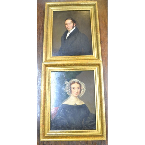 142 - A pair of 19th century oil on board portraits in later distressed gilt frames