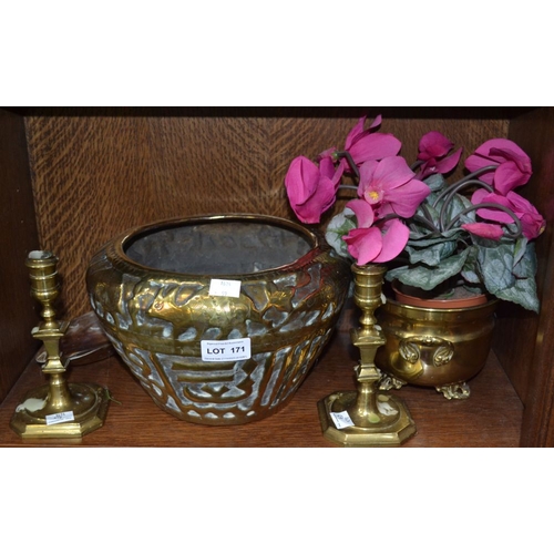 171 - A pair of 19th century brass candlesticks 15 cm high and a shell in a brass planter