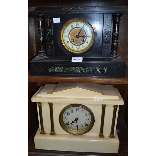 172 - A black slate mantel clock, together with a cream example