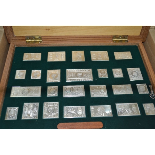 195 - A presentation box of cast silver reproduction stamps produced for the 1977 jubilee c480gms