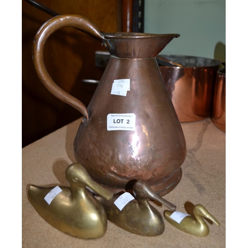 2 - A copper jug and a trio of brass ducks