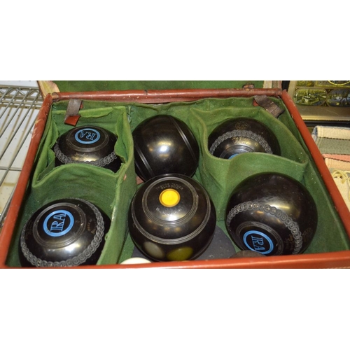 246 - A leather case containing six bowling balls