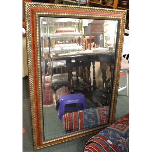 276 - A modern gilt & wood effect bevelled edge mirror