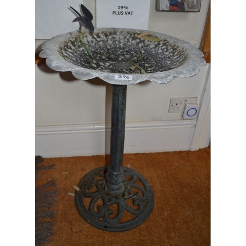 396 - A cast metal bird bath, floral bowl top with bird figure to rim