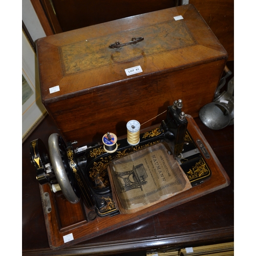 81 - A Maumann sewing machine in wooden carry case