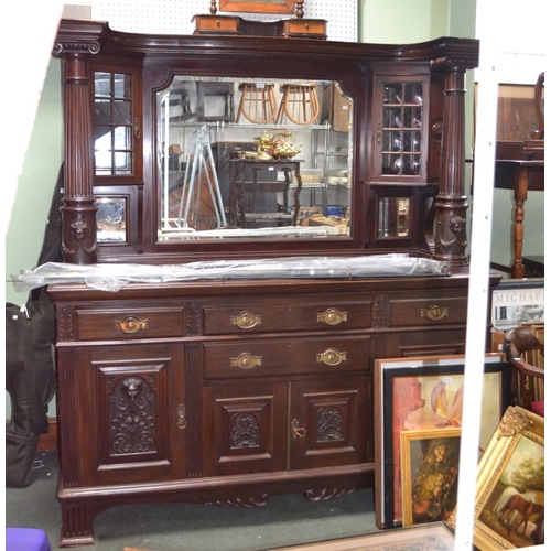 84 - A large mahogany mirror backed sideboard with twin columns