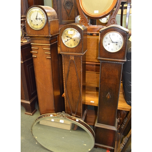 91 - Three Grandmother wooden case clocks