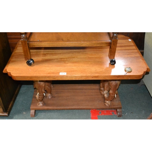 96 - An African two-tier occasional table, elephant supports