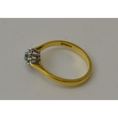 13 - An 18ct gold, diamond and emerald set ring, gross weight 2.7g. ring size L