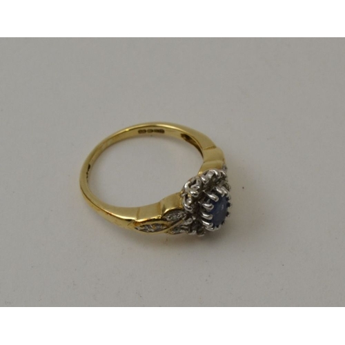 23 - A sapphire and diamond ring, set in a 9ct gold band, ring size M