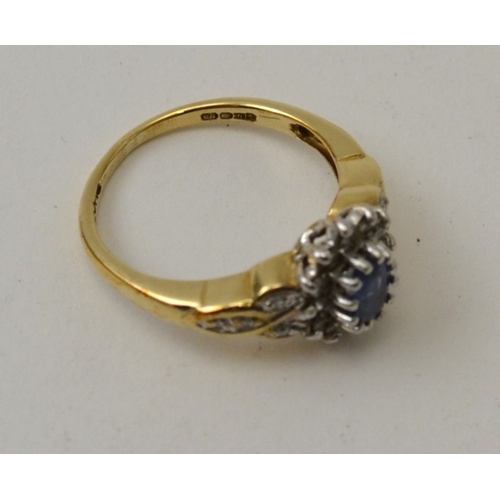 23 - A sapphire and diamond ring, set in a 9ct gold band, ring size M