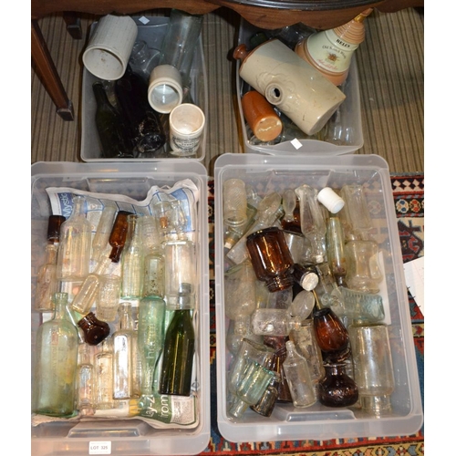 325 - A large collection of 'dug-up' glass bottles and pots -  some local names