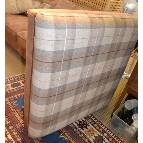 327 - A part leather effect and beige tartan three person settee with large square foot stool