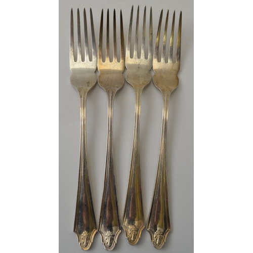 34 - Cooper Brothers & Sons Ltd. A set of four silver dessert forks, Sheffield 1966, together with a set ... 