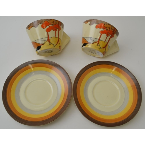 41 - A pair of Clarice Cliff Coral Firs pattern teacups and saucers, conical cups with filled in angular ... 