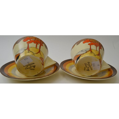 41 - A pair of Clarice Cliff Coral Firs pattern teacups and saucers, conical cups with filled in angular ... 