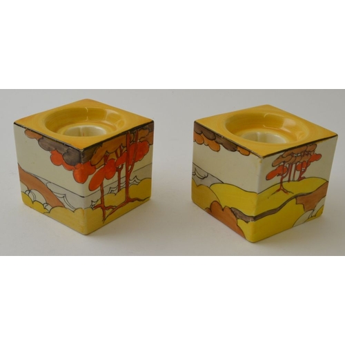 53 - A pair of Clarice Cliff Coral Firs pattern hand painted pottery cube form candle holders, pattern nu... 