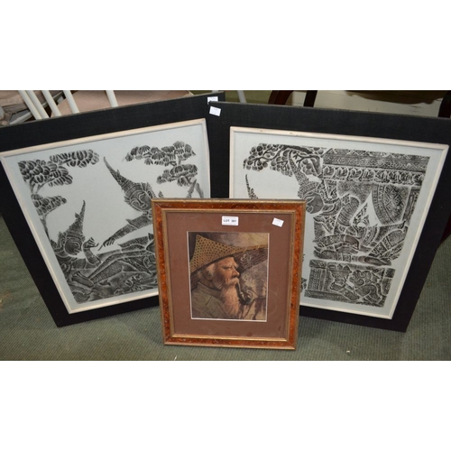 118 - Two Indonesian batik pictures and a portrait painted on a tobacco leaf - framed