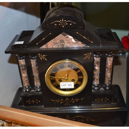 141 - A black slate and marble mantel clock