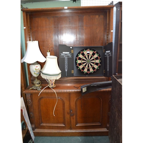 175 - An oak open bookcase on cupboard base