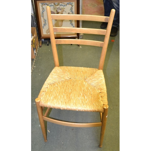 21 - A suite of eight modern beech ladder back chairs with rush seats, Italian made