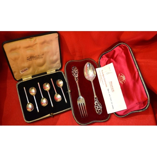 236 - A cased silver Christening set & spoons