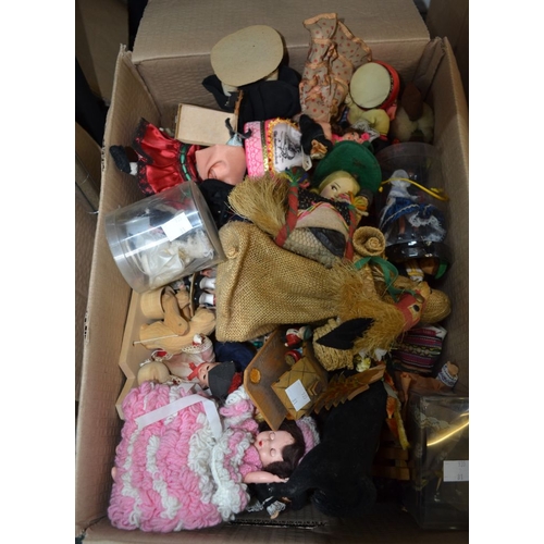 59 - A box containing a good selection of world dolls