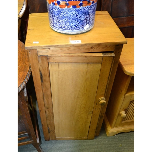 85 - A pine single door bedside cupboard