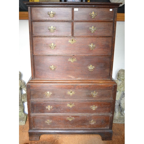 378 - A late George III oak chest on chest, the top section four small over two long drawers. The base fit... 