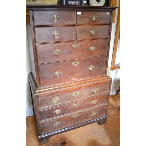 378 - A late George III oak chest on chest, the top section four small over two long drawers. The base fit... 