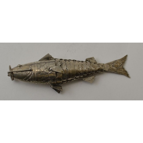 111 - A silver articulated fish, 9cm, together with a silver scent file, a silver thimble, silver cockerel... 