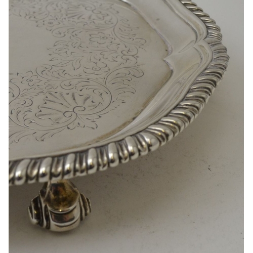 117 - John Parker I & Edward Wakelin, An early George III silver waiter tray, having gadrooned rim, chased... 