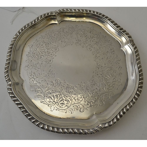 117 - John Parker I & Edward Wakelin, An early George III silver waiter tray, having gadrooned rim, chased... 