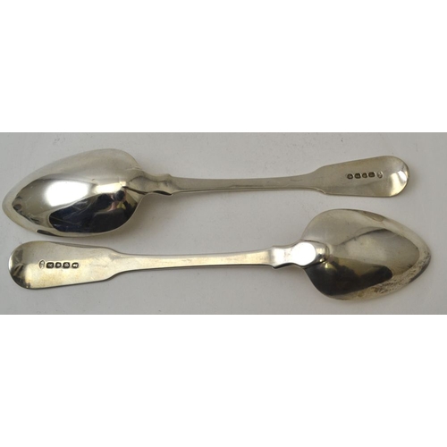 124 - William Seaman, a pair of silver fiddle pattern soup / table spoons, bearing stag head crests, Londo... 