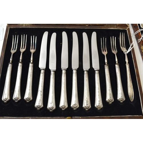 130 - An early 20th century cased set of silver handled dessert knives & forks, for six settings, Sheffiel... 