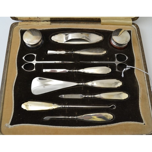 137 - Daniel Manufacturing Co. A cased silver mounted dressing table set, Birmingham 1927,comprising; two ... 