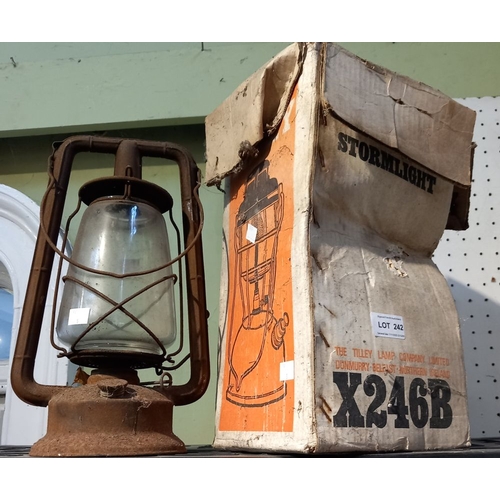 242 - A tilly storm light in original box with an older example