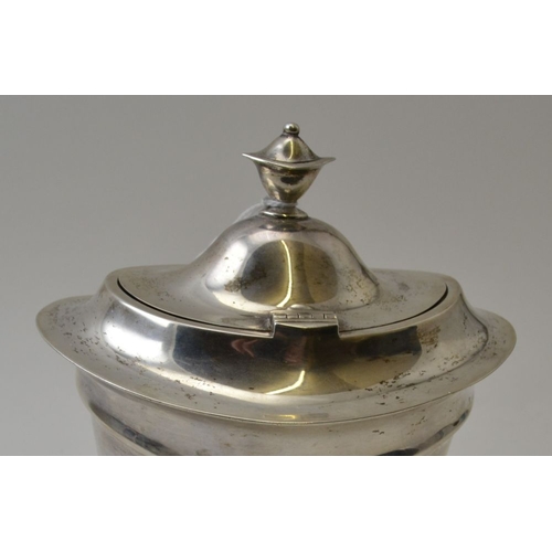 96 - Asprey and Co Ltd, a Regency design silver tea caddy, hinged cover raised on an oval base, Sheffield... 