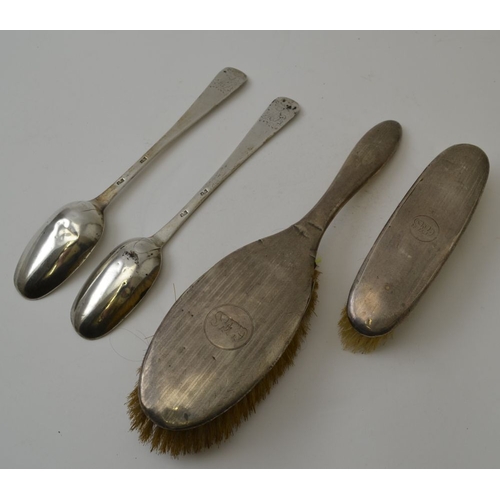 98 - Two early silver serving spoons and two silver backed dressing table brushes, the spoons combined we... 