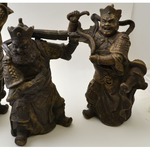 101 - A set of four Chinese ceramic Temple Guardians, each modelled as a fearsome armed figure, tallest 32... 